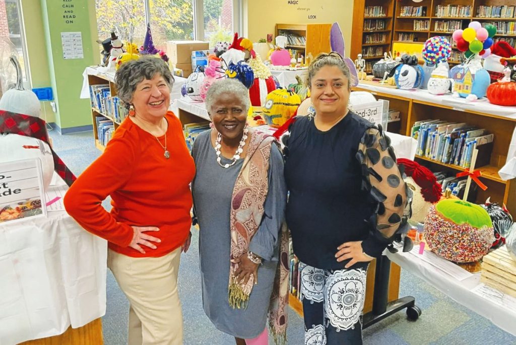 Lynn Carter, Deborah Nails, and Binnie Kaur in the library